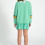 short skirt | green w/ black hearts allover