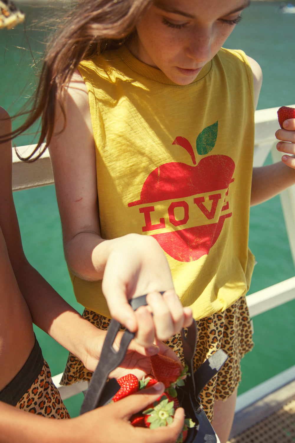 sleeveless top | mustard w/ apple print